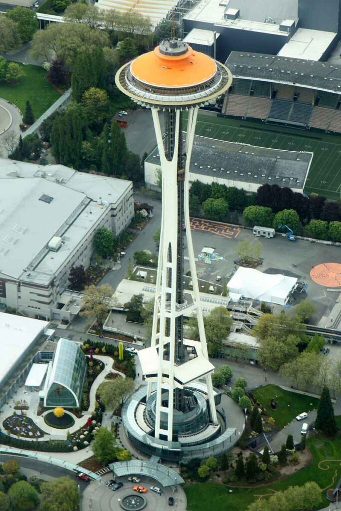 An aerial view of the Space Needle painted gold for its 50th anniversary celebration.