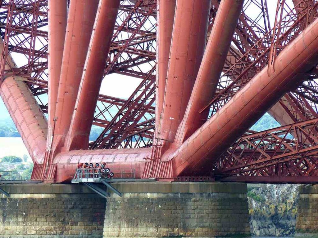 Close up on the base of one of the three double-cantilevers of the Forth Bridge, Edinburgh, Scotland.