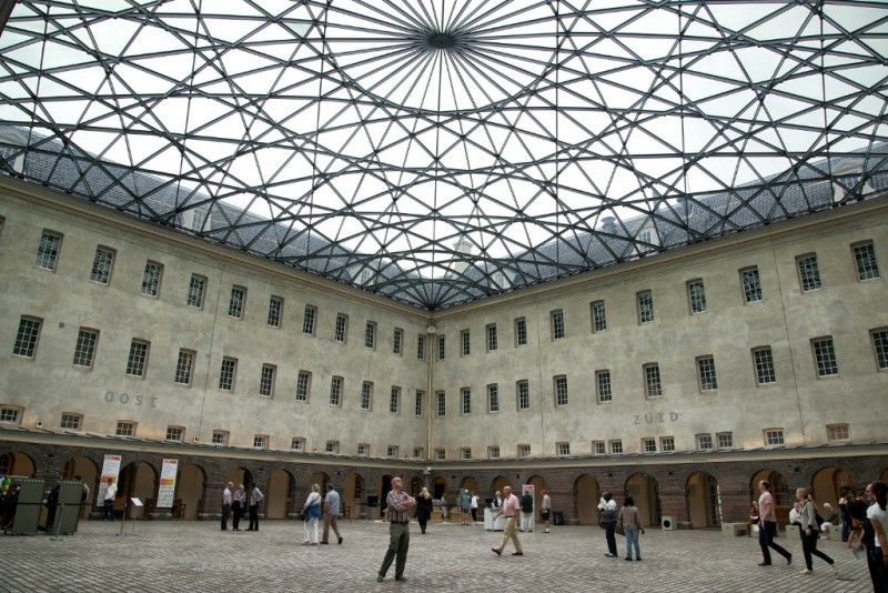 Interior courtyard of the Nederlands Scheepvaartmuseum during a heavy rainstorm.